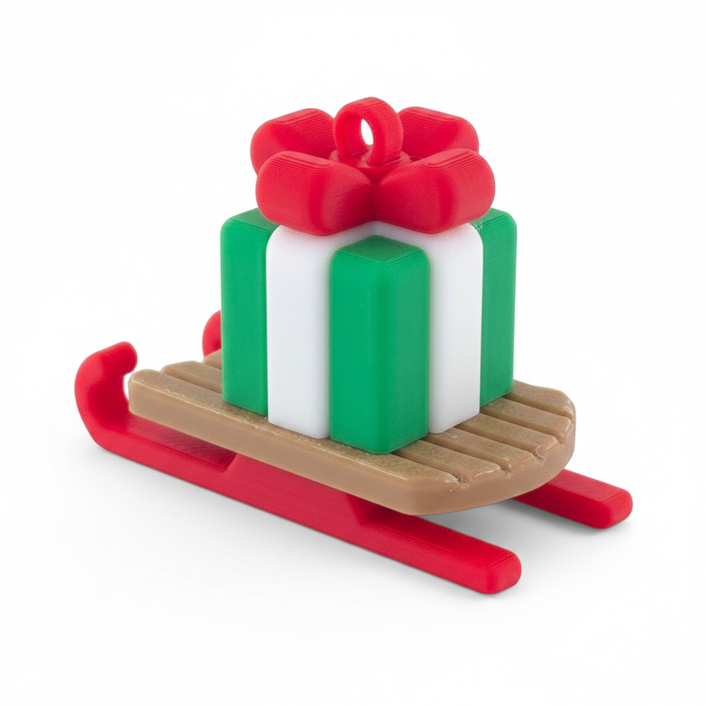 gingerbread-style Christmas ornament featuring a green and white gift box on a red wooden sled