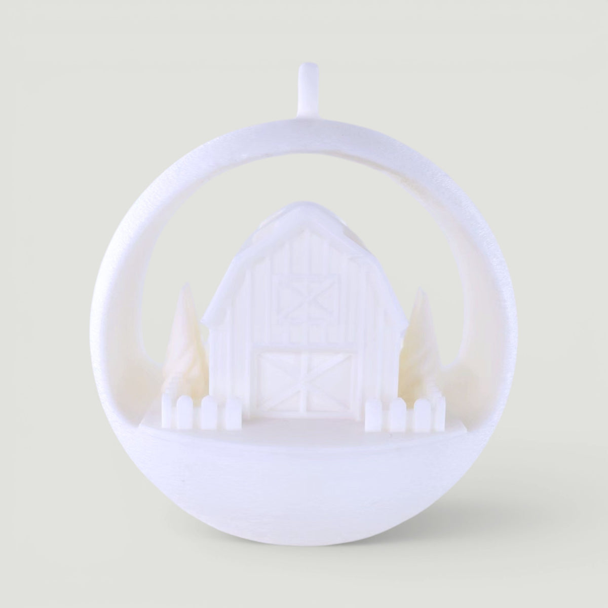 white PLA plastic illuminated winter barn ornament with trees and picket fence, rustic holiday decor. Light off, front center of ornament.