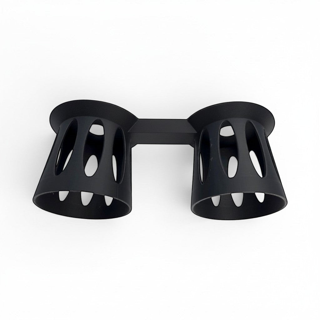 black PLA plastic dual cup holder with an open-vented design for stable drink mixing stations. Top angle.