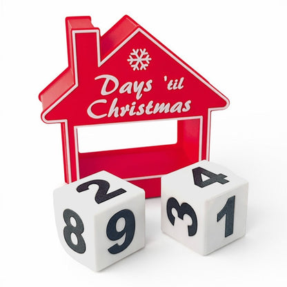 red house-shaped Christmas countdown advent calendar with two white numbered blocks. Front of house with two blocks on the outside.