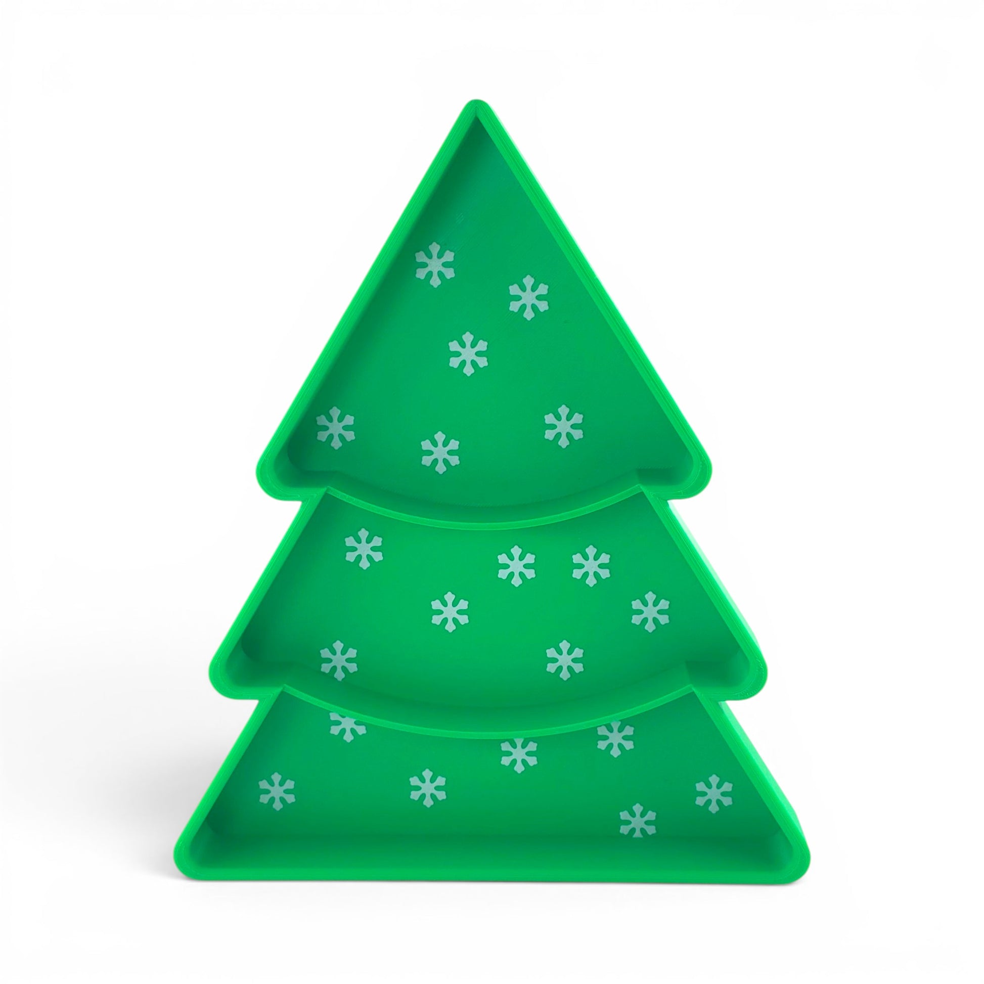 Green Christmas tree serving tray with white snowflake pattern and tiered compartments for candy. Front of Tray.