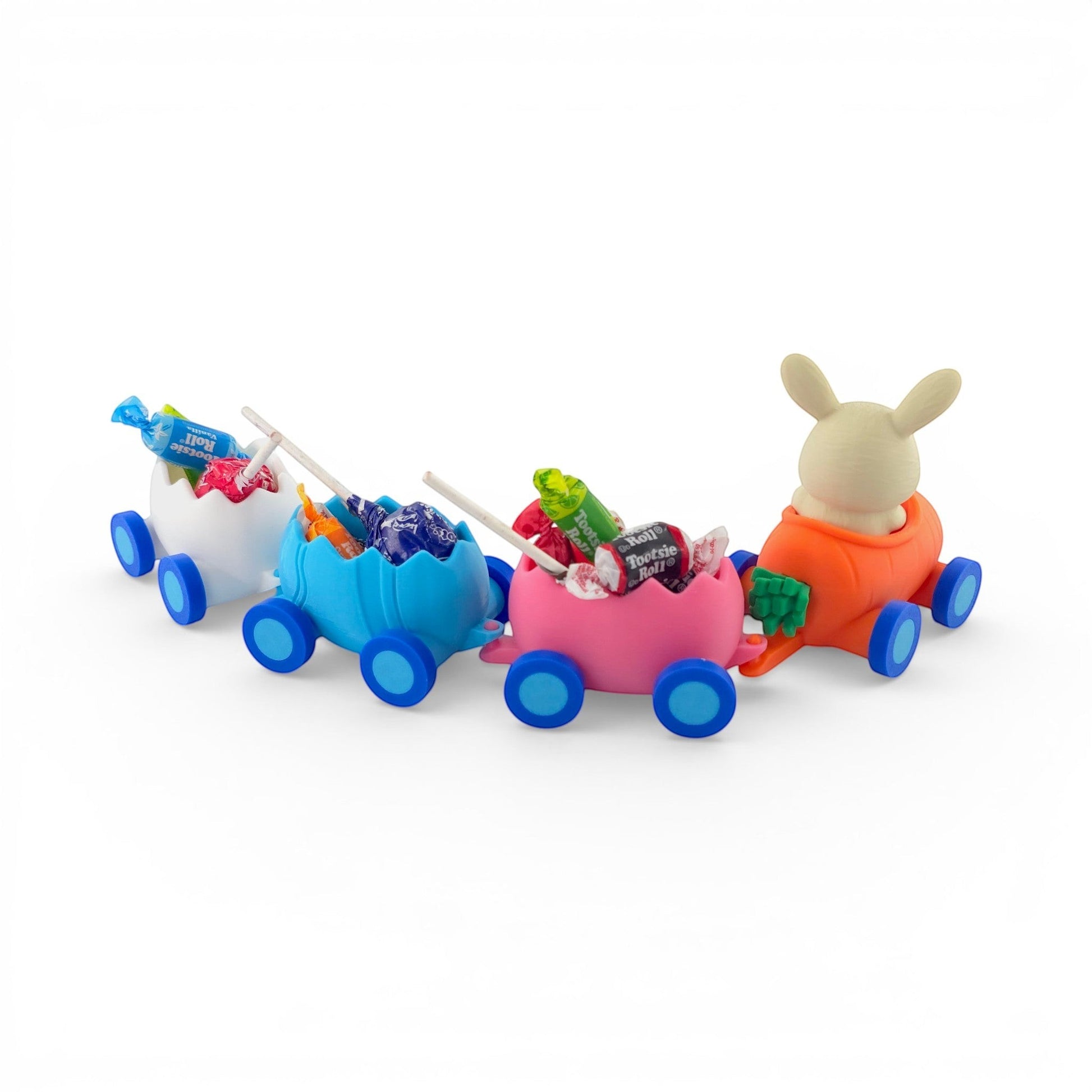Easter Train Candy Holder with pink, blue, and white egg carriages and a bunny in a carrot engine. Right view of train with candy.