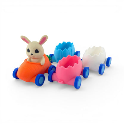 Easter Train Candy Holder with bunny in carrot engine, pink, blue, and white egg carriages on wheels. Front left view of train taken apart.