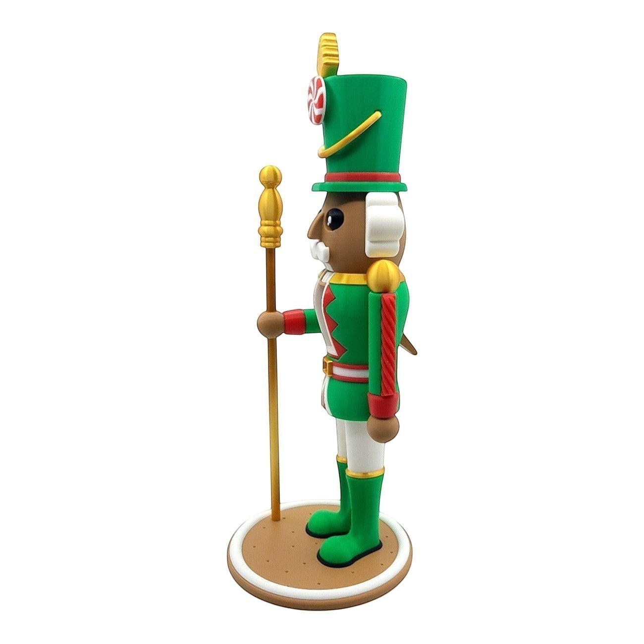 Green nutcracker decoration with gold accents, candy cane hat, and staff. Festive holiday decor.