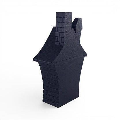 Black PLA flickering haunted house decoration with brick chimney and wood-textured walls. Back right corner of house.