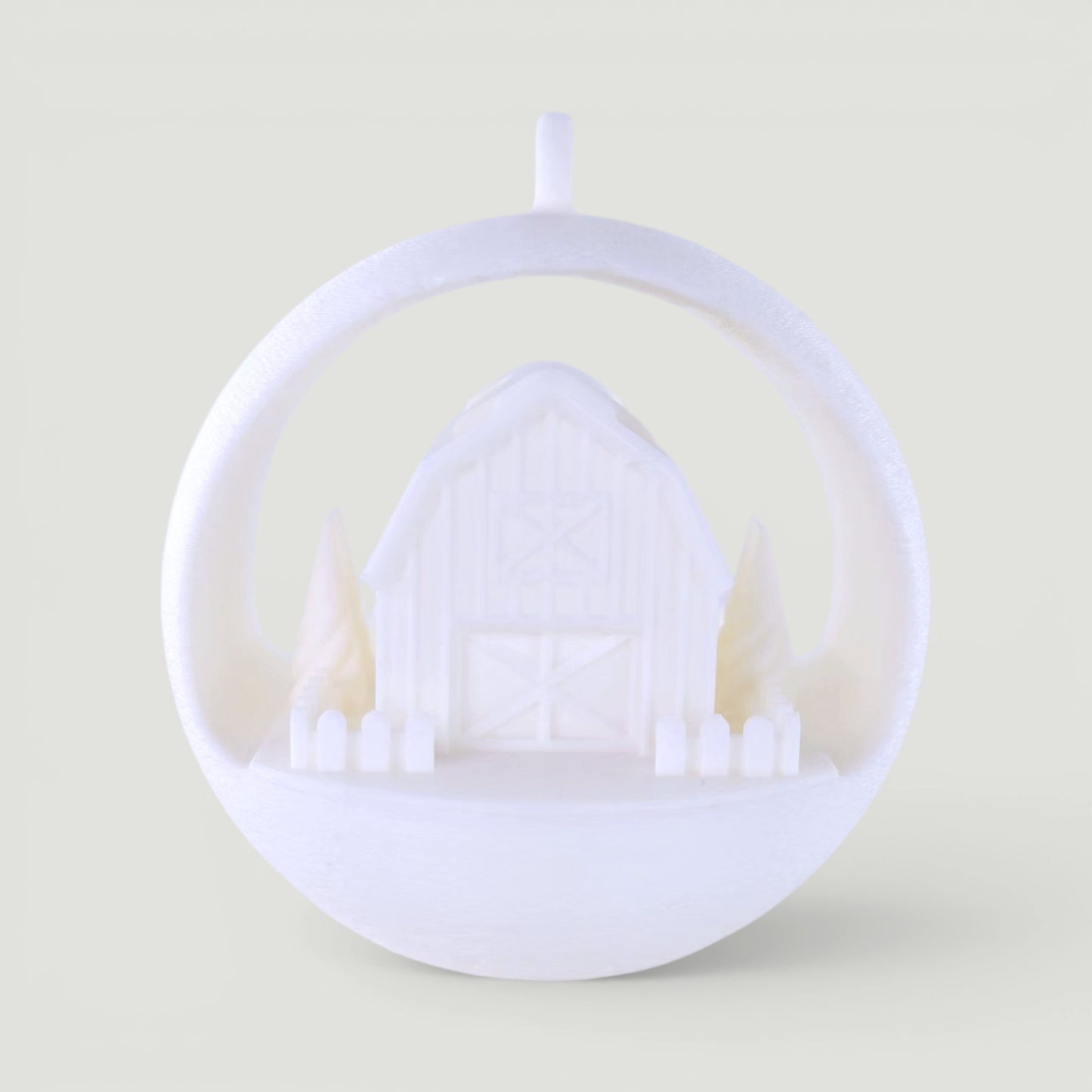 white PLA plastic illuminated winter barn ornament with trees and picket fence, rustic holiday decor. Light off, front center of ornament.