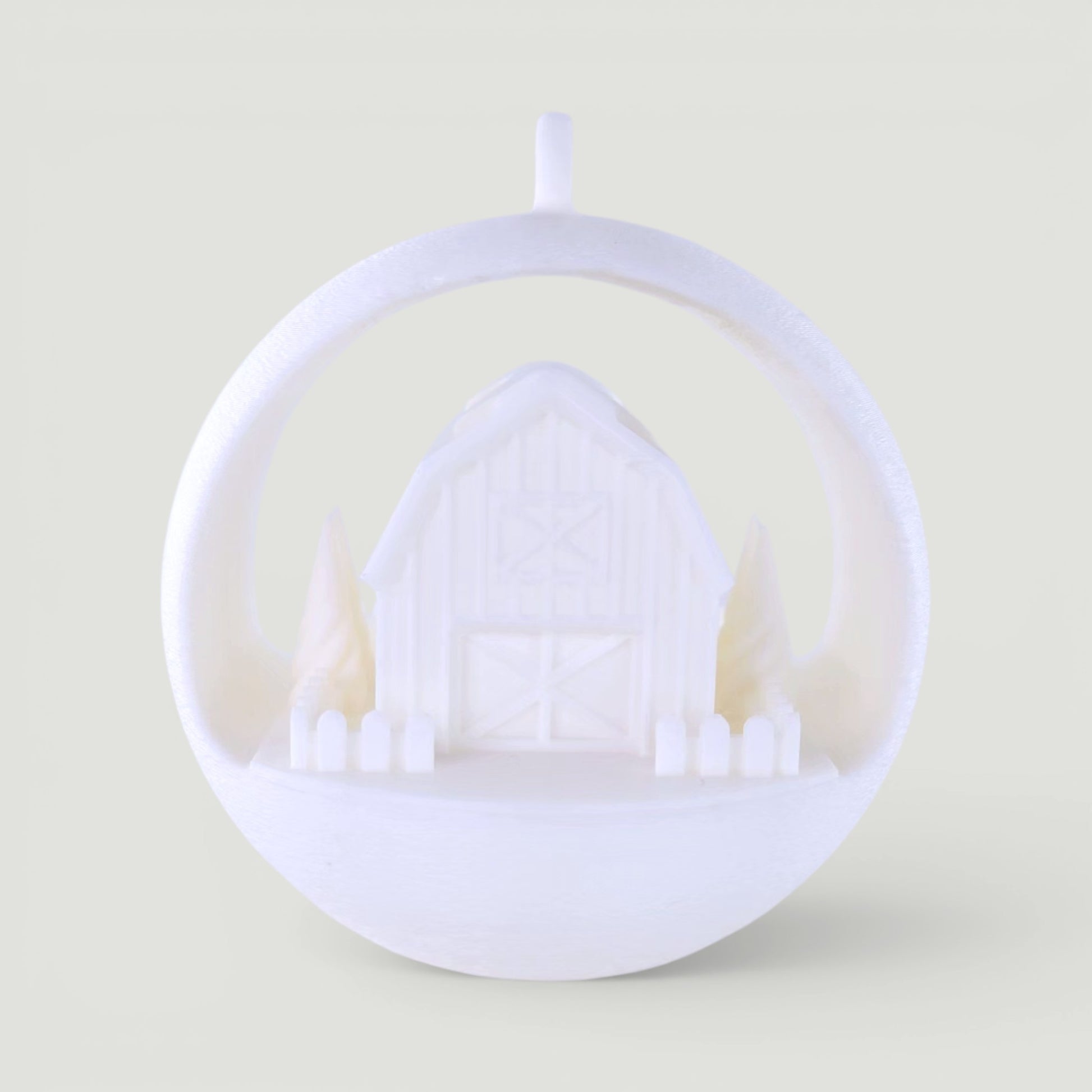 white PLA plastic illuminated winter barn ornament with trees and picket fence, rustic holiday decor. Light off, front center of ornament.