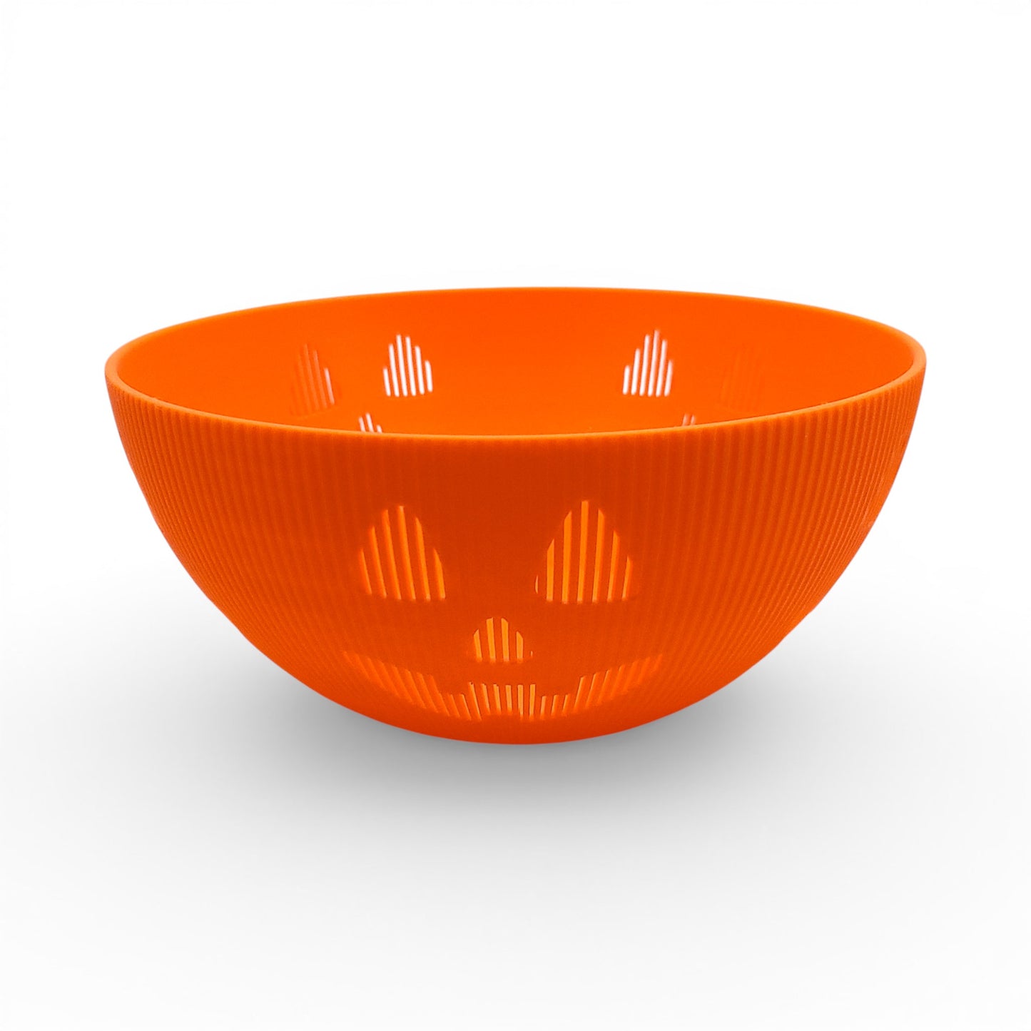 Orange PLA plastic Jack-o'-lantern candy bowl with carved face details and ribbed texture. Front of bowl, empty.