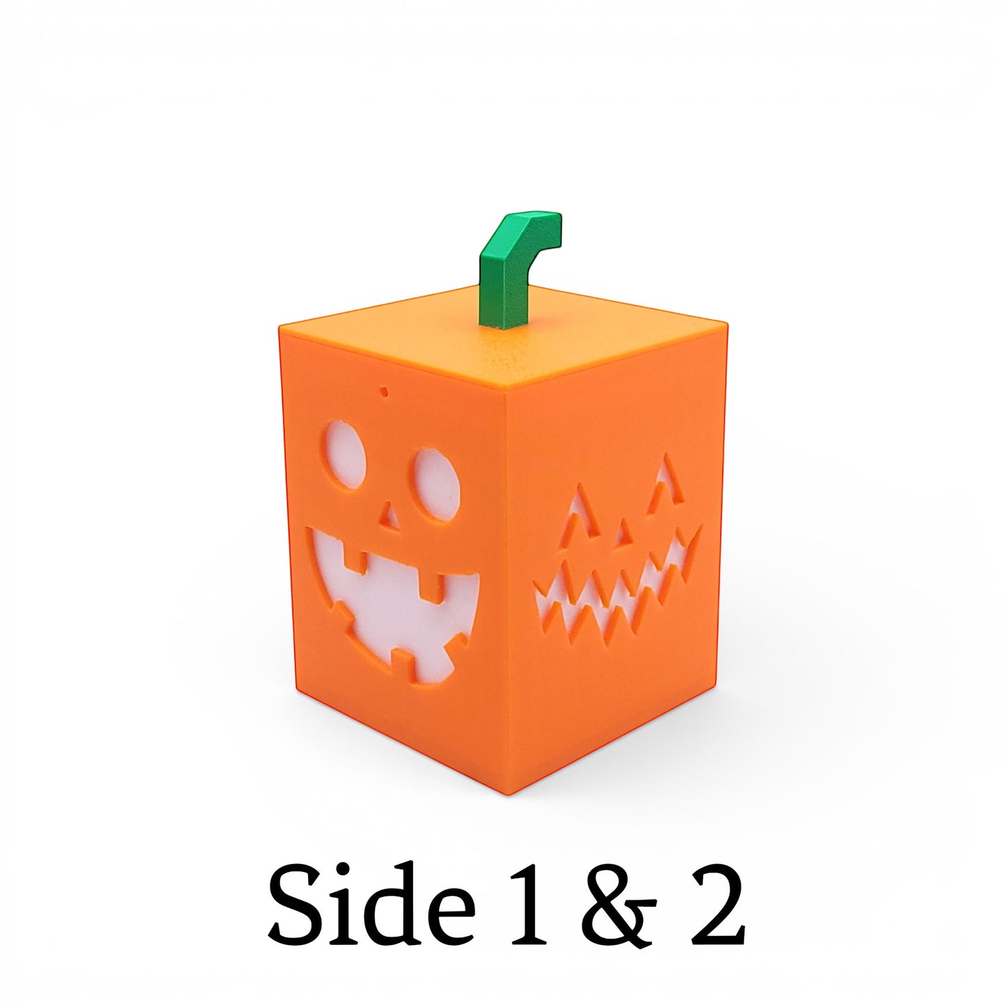 Orange PLA cube light with playful jack-o'-lantern faces on each side and a green stem.