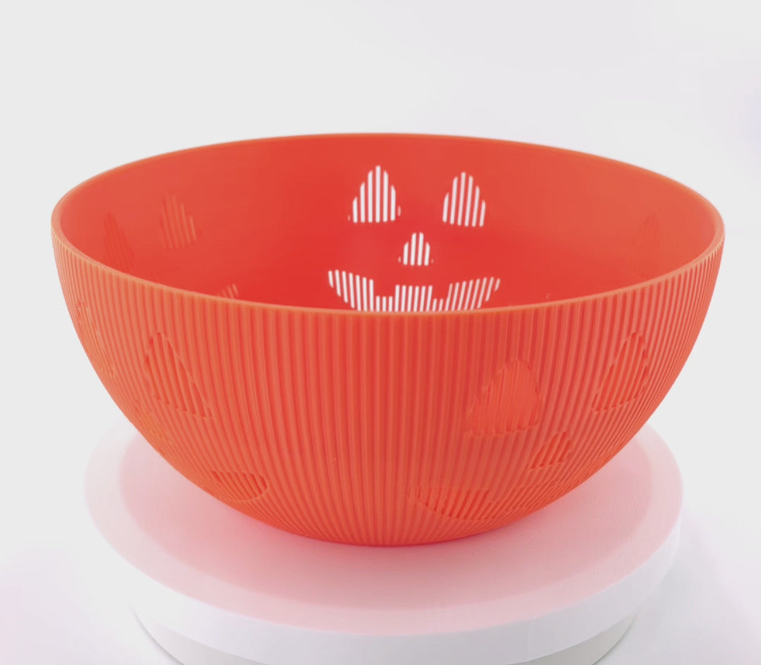 Rotating jack-o'-lantern candy bowl. First half of the video the bowl is empty and the second half of the video the bowl is full of candy.