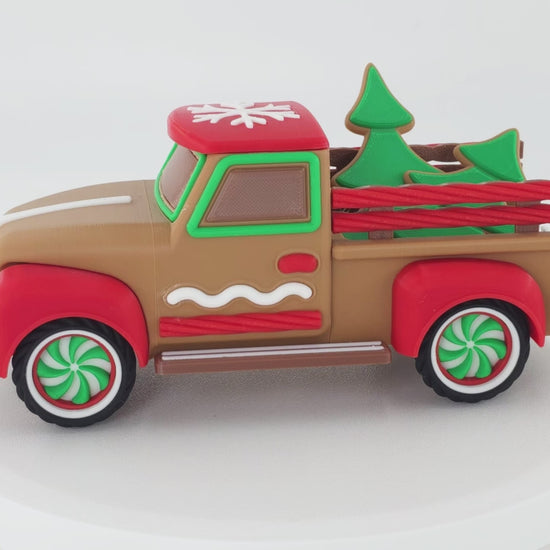 Rotating Vintage Christmas Truck Decoration featuring Christmas Tree cookie cutouts and candy themed decor. 