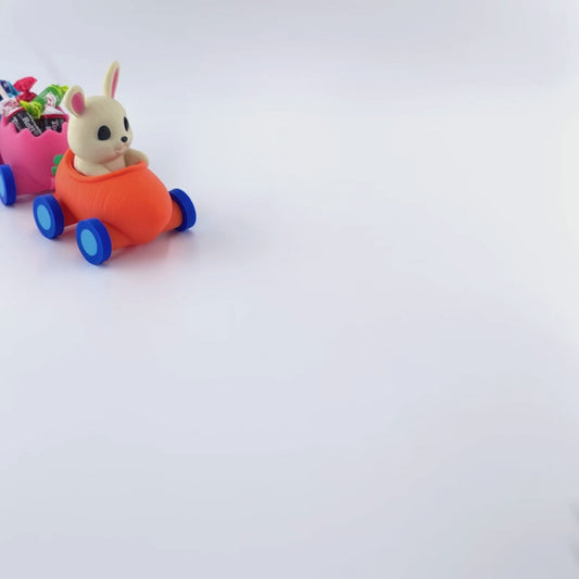 Easter train with a hand moving into frame to show that the wheels move and are not stationary. 