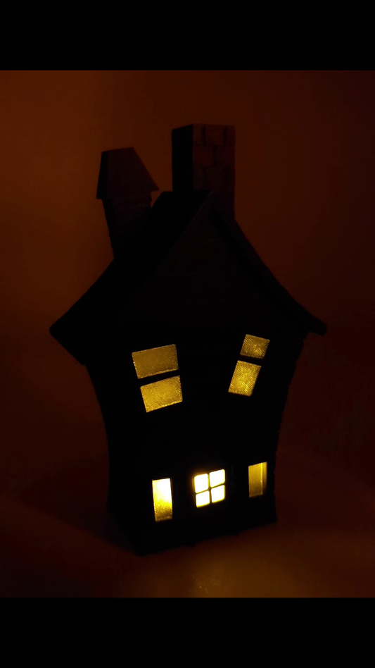 Rotating Flickering Haunted House Decoration. First half LED lights off. Second half LED lights on. 