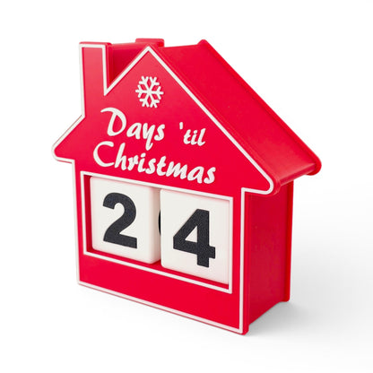 red house-shaped Christmas countdown advent calendar with rotating number blocks on a white base. Front right view of house with two blocks inside.