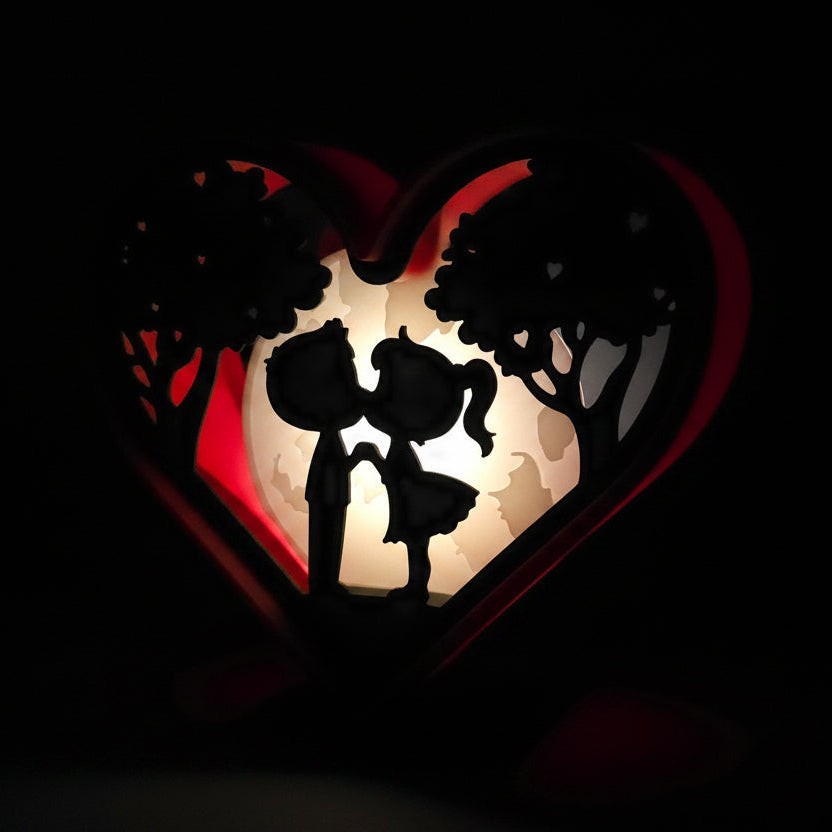 Valentines Heart Light Box with couple silhouette under moonlight, red frame, romantic decor.