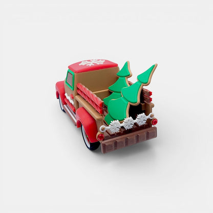 Vintage Christmas truck decoration in tan, red, and green with gingerbread cookie trees and snowflake detail.